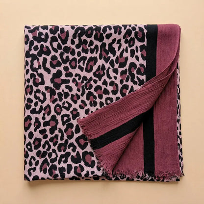 Berry Blush Leopard Print Scarf flat lay on a warm beige background